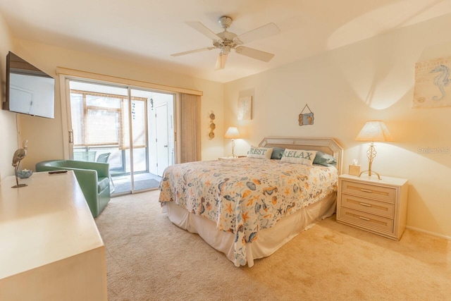 carpeted bedroom featuring access to exterior and ceiling fan