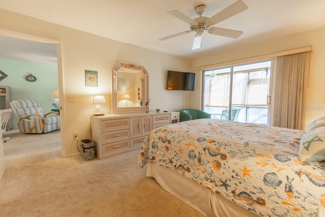 bedroom featuring access to outside, light colored carpet, and ceiling fan