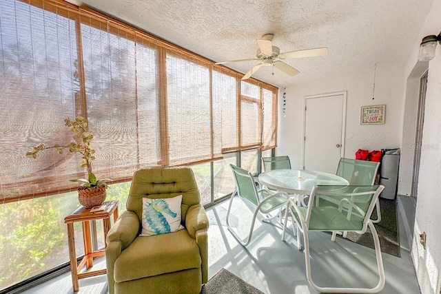 sunroom featuring ceiling fan