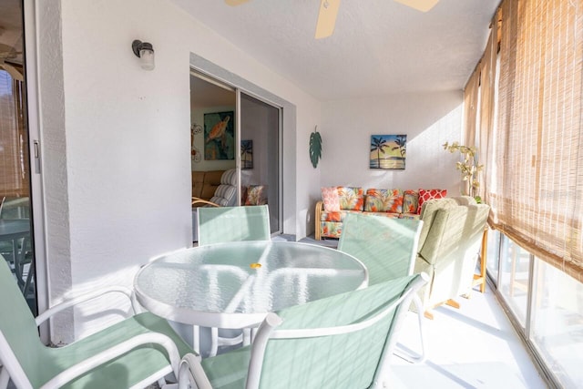 sunroom / solarium with ceiling fan