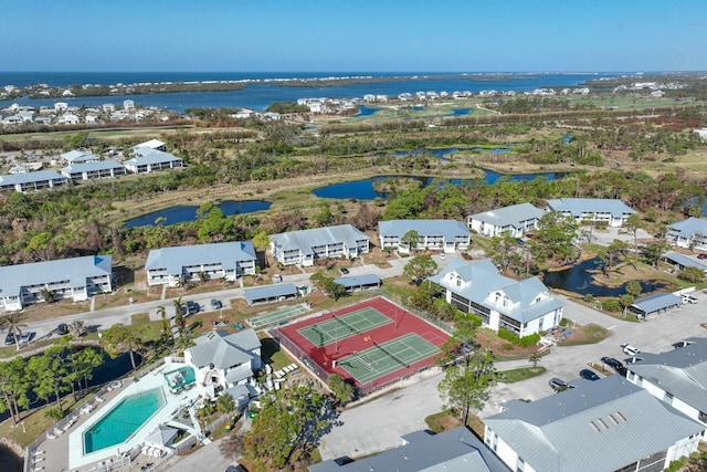 birds eye view of property with a water view