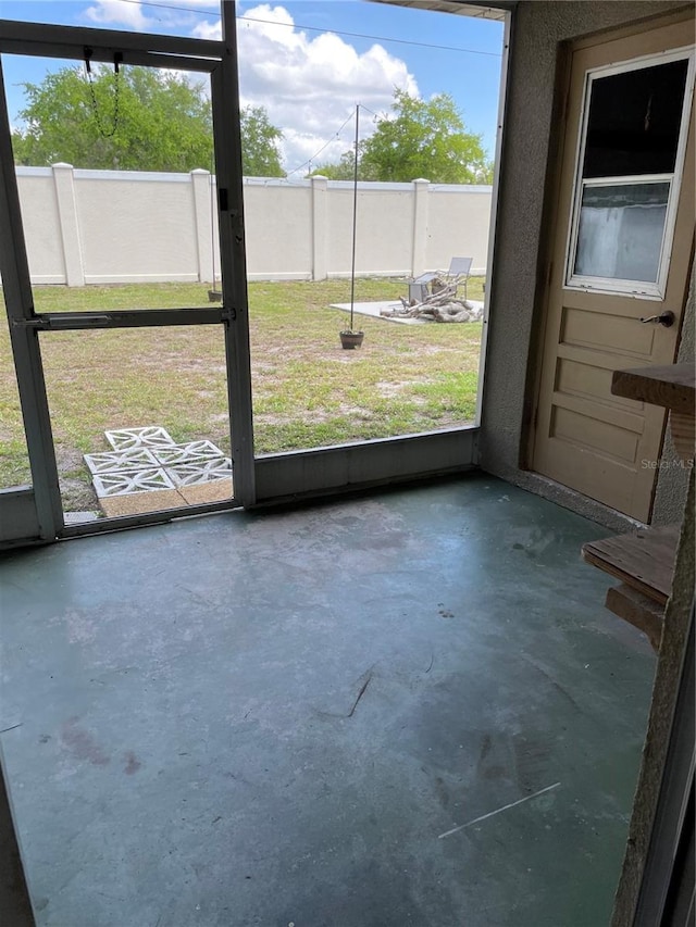 unfurnished sunroom with a wealth of natural light