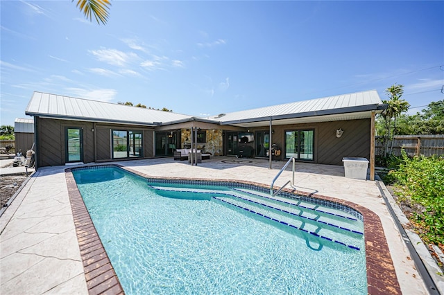 view of swimming pool featuring a patio area