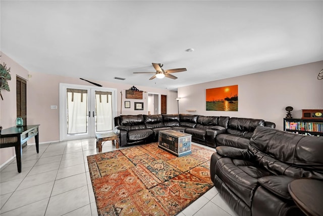 tiled living room with french doors and ceiling fan