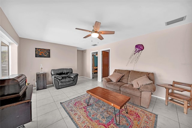 living room with light tile patterned floors and ceiling fan