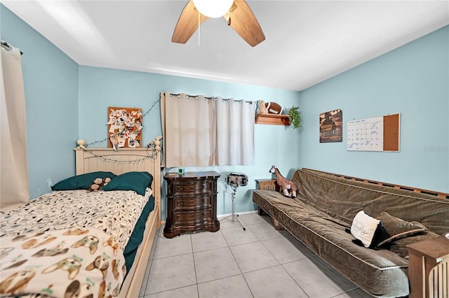 tiled bedroom featuring ceiling fan