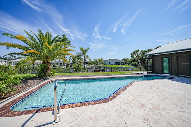 view of swimming pool with a patio area