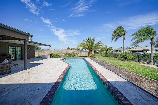 view of swimming pool featuring a patio area