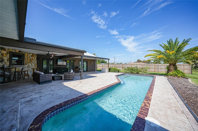 view of pool featuring a patio, an outdoor hangout area, and ceiling fan