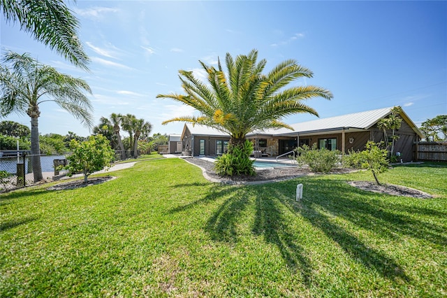 view of yard featuring a fenced in pool