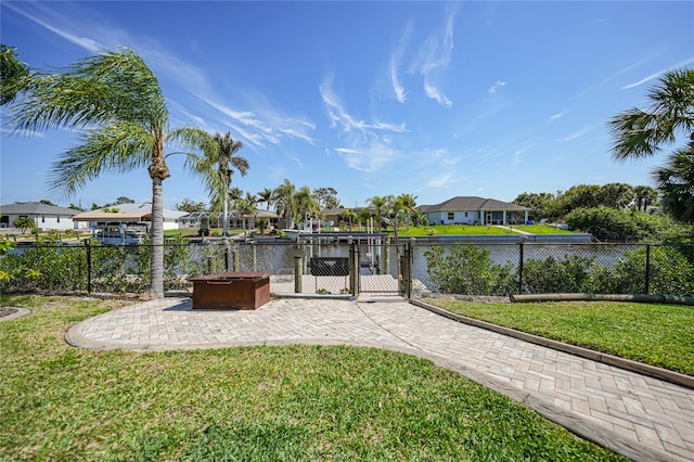 view of yard featuring a patio area and a water view