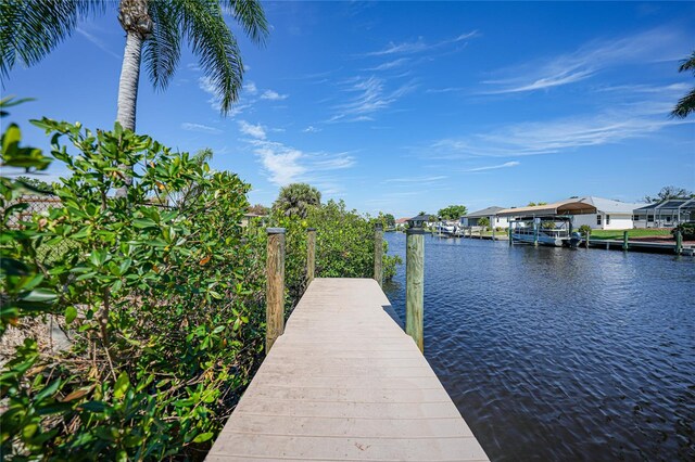 view of dock with a water view