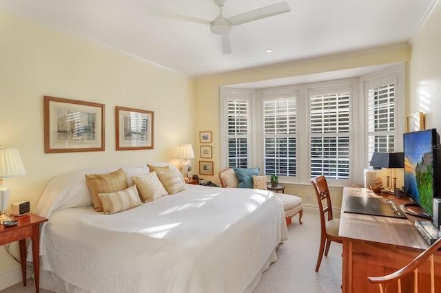 bedroom featuring ceiling fan and light carpet