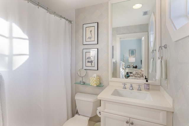 bathroom with vanity and toilet