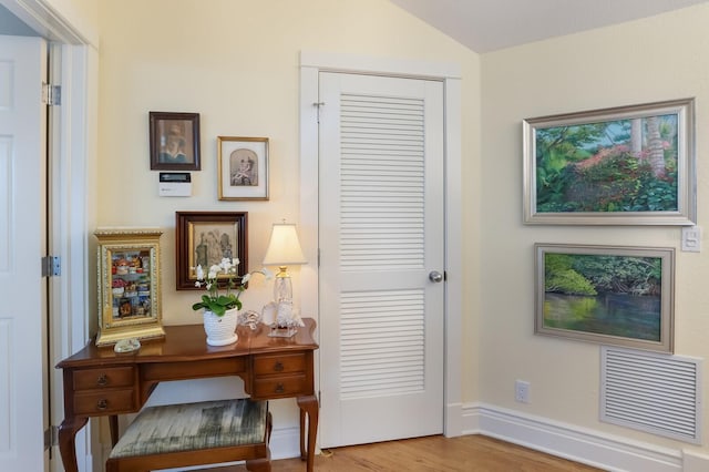 521 Buttonwood Bay Dr, Boca Grande, FL 33921 - office space featuring wood finished floors, vaulted ceiling, and baseboards