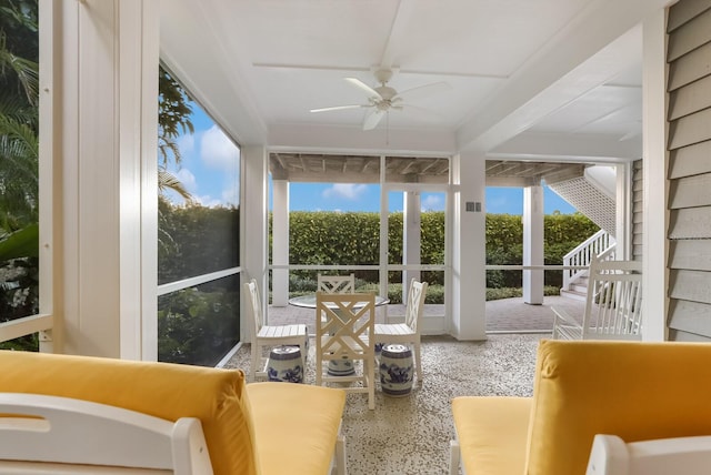 sunroom / solarium with ceiling fan and plenty of natural light