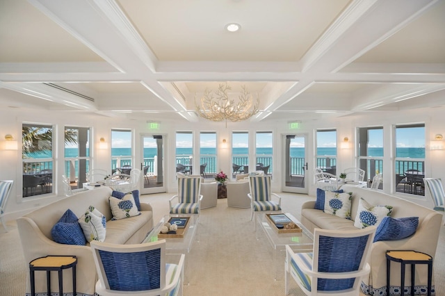 sunroom / solarium with coffered ceiling, beamed ceiling, a water view, and a healthy amount of sunlight