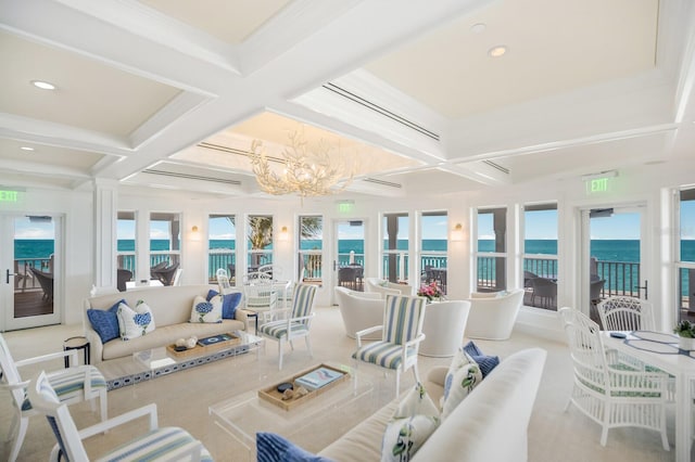 sunroom featuring coffered ceiling, beamed ceiling, a water view, and an inviting chandelier