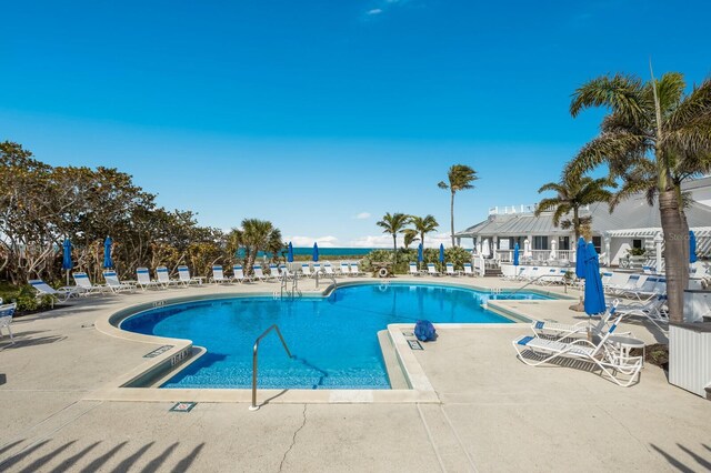 view of swimming pool with a pergola and a patio area