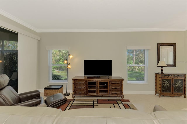 living room with light tile patterned floors, crown molding, and a healthy amount of sunlight