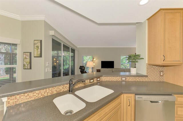 kitchen featuring crown molding, sink, stainless steel dishwasher, light brown cabinetry, and kitchen peninsula