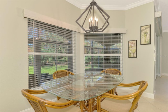 tiled dining space featuring a chandelier and crown molding