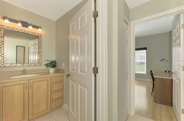 bathroom featuring tile patterned floors and vanity