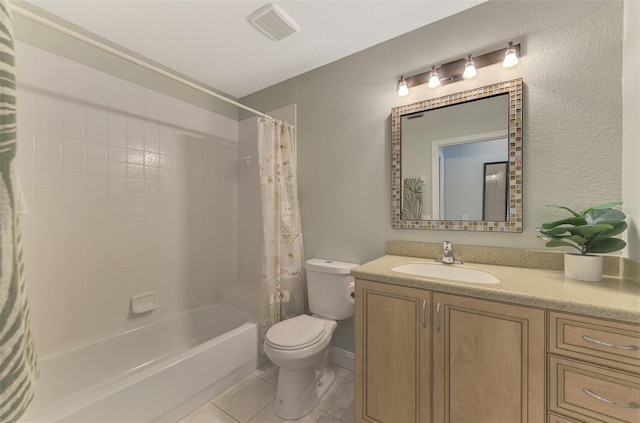 full bathroom with tile patterned flooring, vanity, toilet, and shower / bath combo with shower curtain