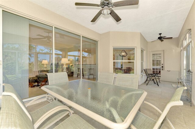 sunroom / solarium with ceiling fan