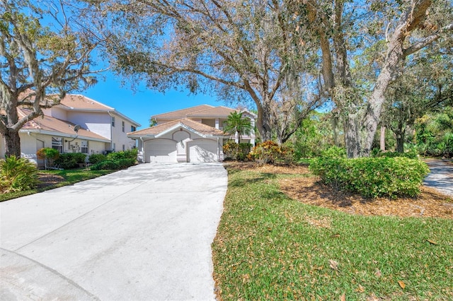 view of front of house featuring a front yard and a garage