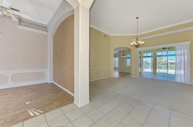 unfurnished room featuring crown molding, light colored carpet, and ceiling fan with notable chandelier