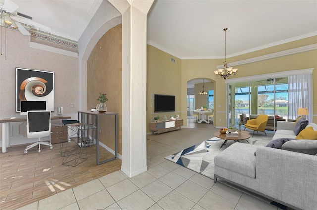 living room featuring a notable chandelier, ornamental molding, and light wood-type flooring