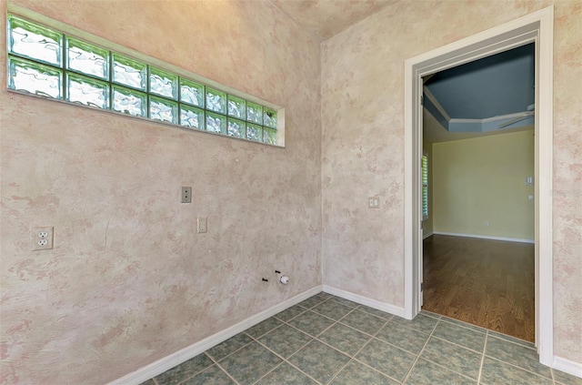 clothes washing area with crown molding and dark hardwood / wood-style floors