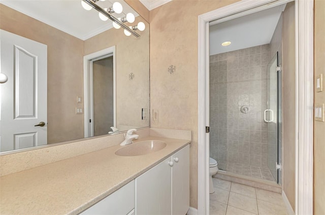 bathroom with toilet, tile patterned flooring, a shower with shower door, ornamental molding, and vanity