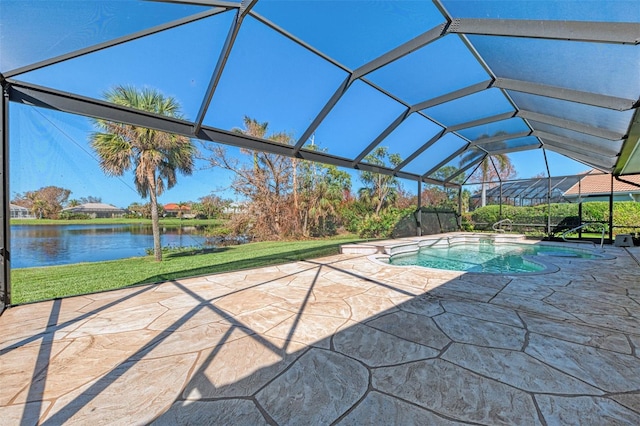 view of swimming pool featuring a patio, a water view, and glass enclosure