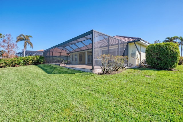 view of yard featuring a patio area and glass enclosure