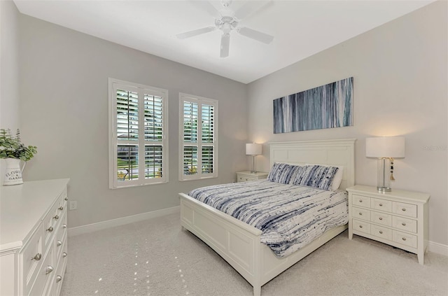 bedroom featuring ceiling fan and light carpet