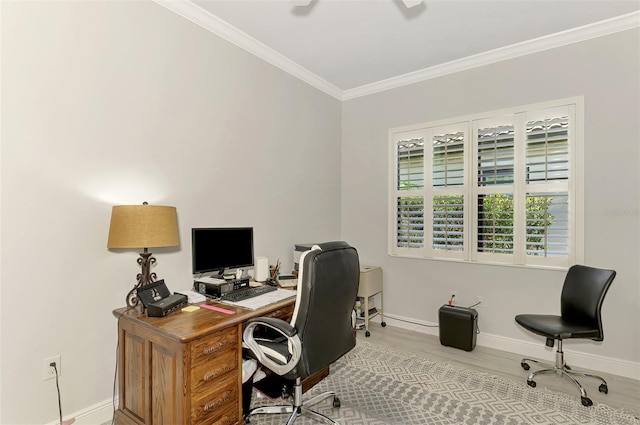 home office with ornamental molding and light hardwood / wood-style flooring