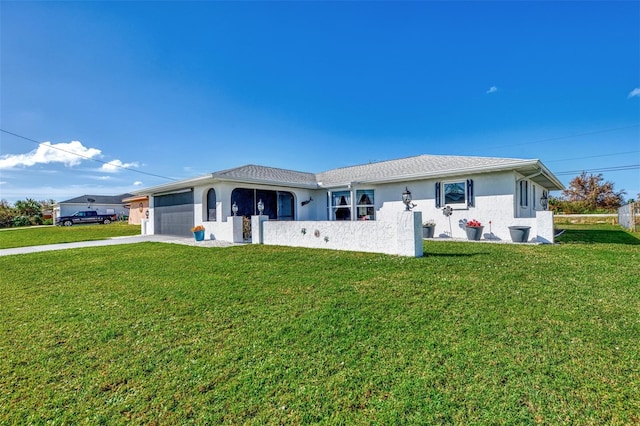 single story home featuring a front yard and a garage