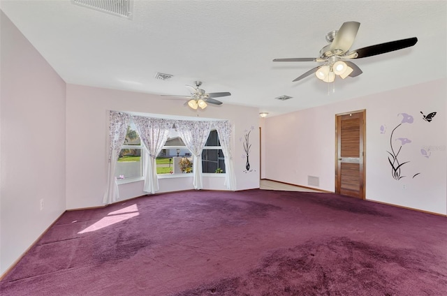 spare room with carpet and ceiling fan