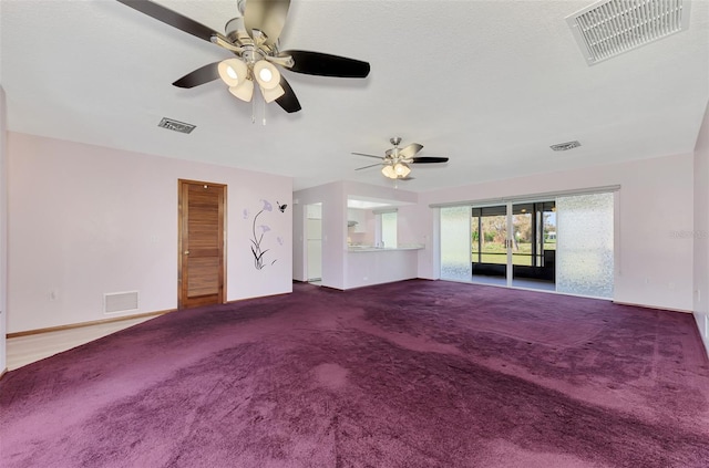 unfurnished living room with ceiling fan and carpet floors