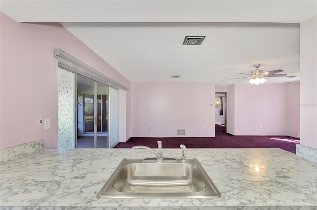 kitchen featuring sink and ceiling fan