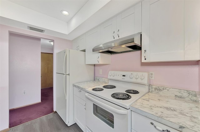 kitchen featuring white cabinets, light stone counters, white appliances, and light hardwood / wood-style floors