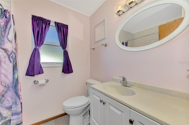 bathroom featuring vanity, ornamental molding, a shower with curtain, and toilet