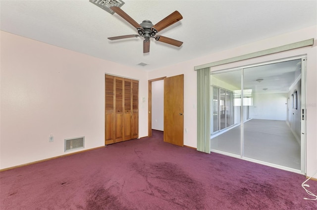 unfurnished bedroom with carpet floors, a closet, and ceiling fan