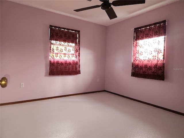 spare room with ceiling fan