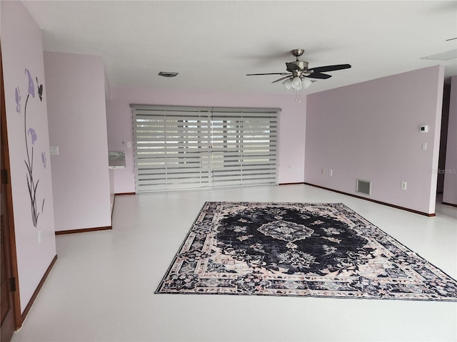 interior space with concrete floors and ceiling fan