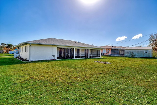 back of house featuring a yard