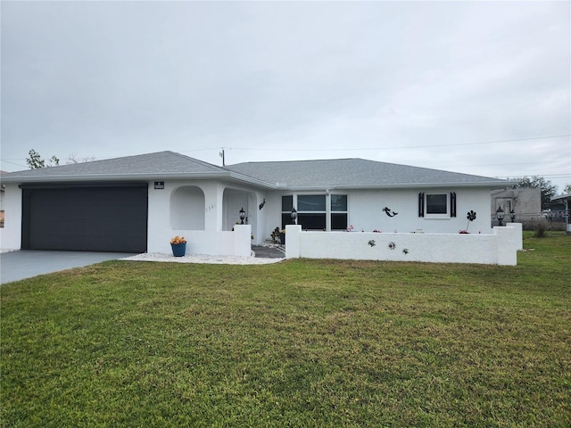 ranch-style house featuring stucco siding, driveway, a garage, and a front lawn