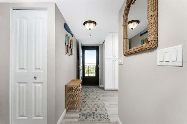 entryway with light hardwood / wood-style flooring